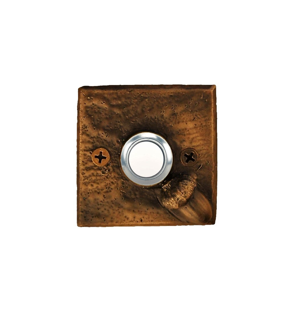 Square bronze doorbell plate with acorn in lower right corner